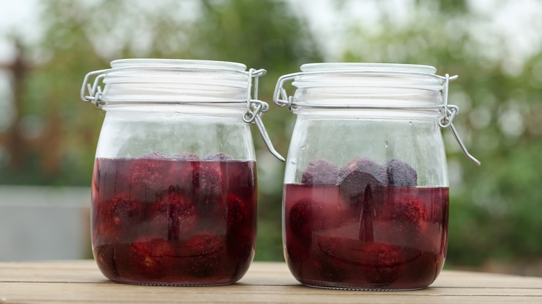 two jars with metal clasps