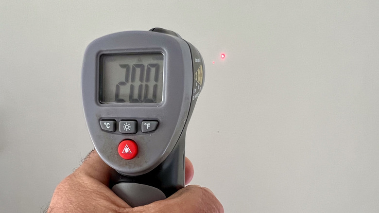 hand using infrared thermometer