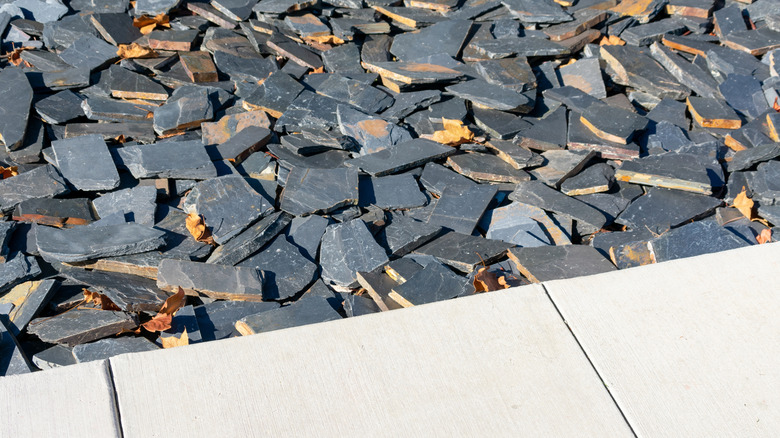 Gray slate chips line a stone walkway