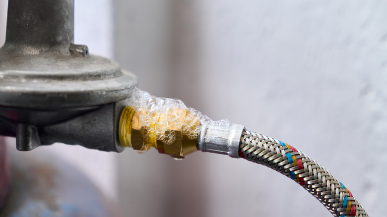 Soapy bubbles on a gas pipe indicate a leak.