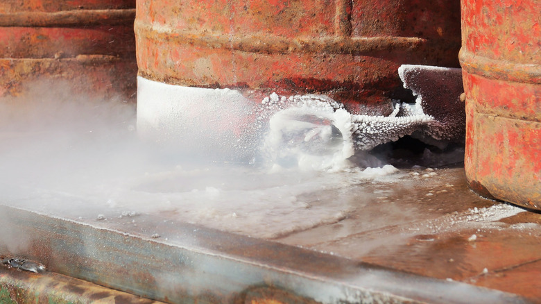 A gas leak causing misty air and frosty surfaces.