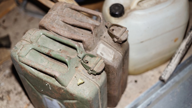 Old and dusty jerrycans that may hold old gasoline