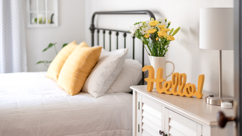 yellow details in neutral bedroom