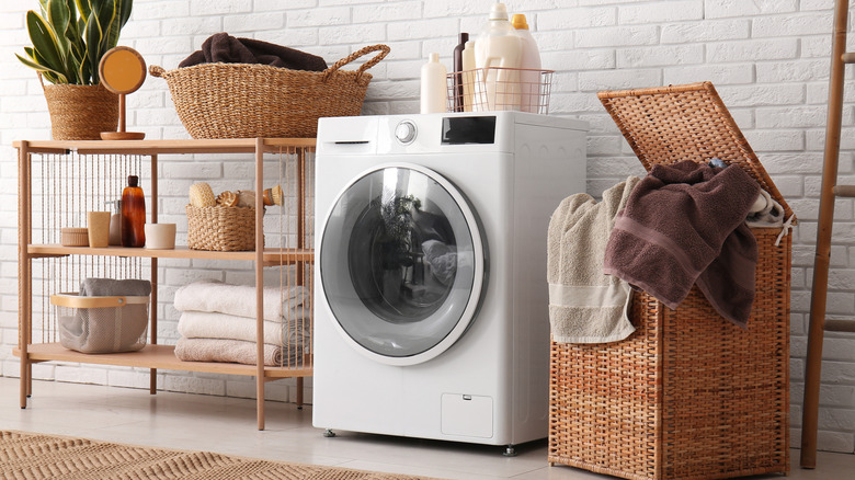 A laundry room with multiple wicker baskets