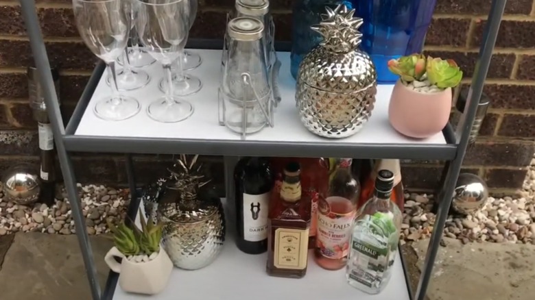 Metal cart with outdoor bar supplies