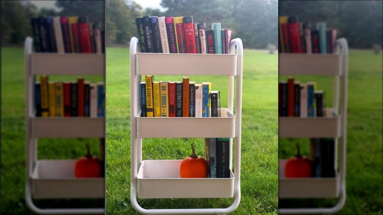 Orange enamel cart next to hammock