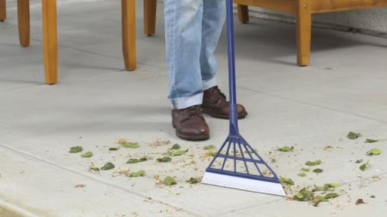 Man using Casabella Rubber Blade Squeegee Broom