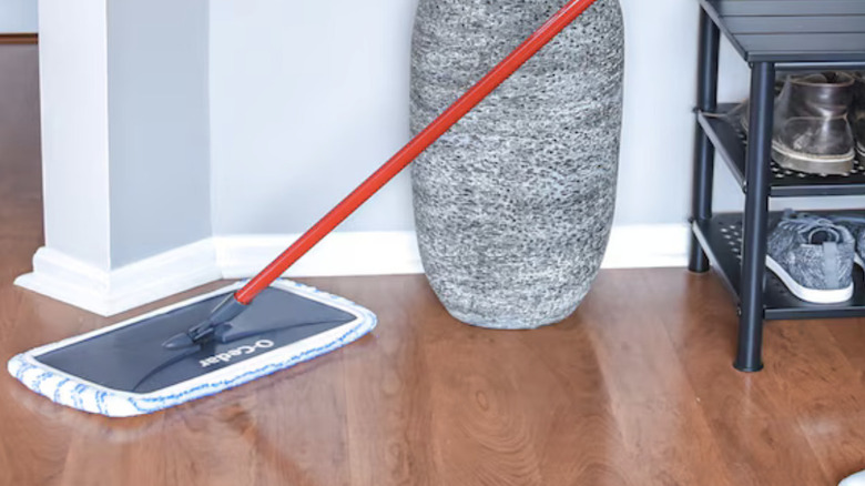 Person using O-Cedar Hardwood Floor Dust Mop on wood floor