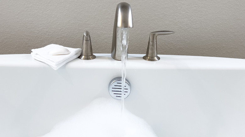 Close-up of a bathtub filling with water