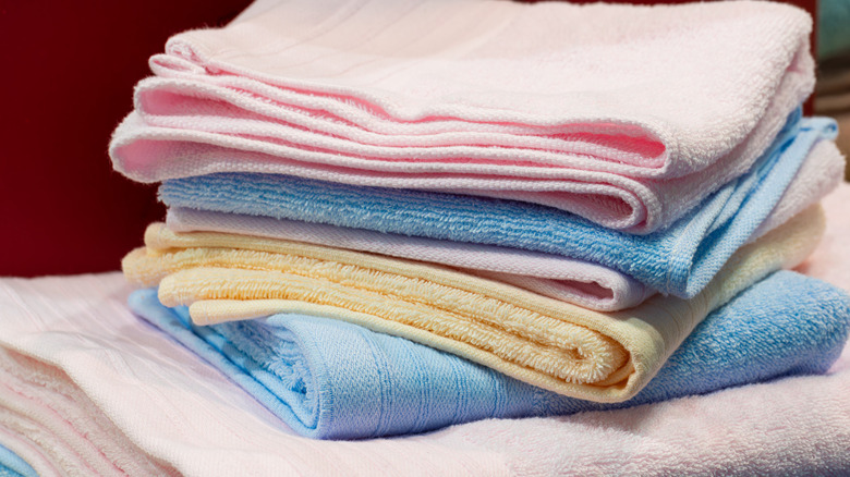 Stack of washcloths and towels in various colors