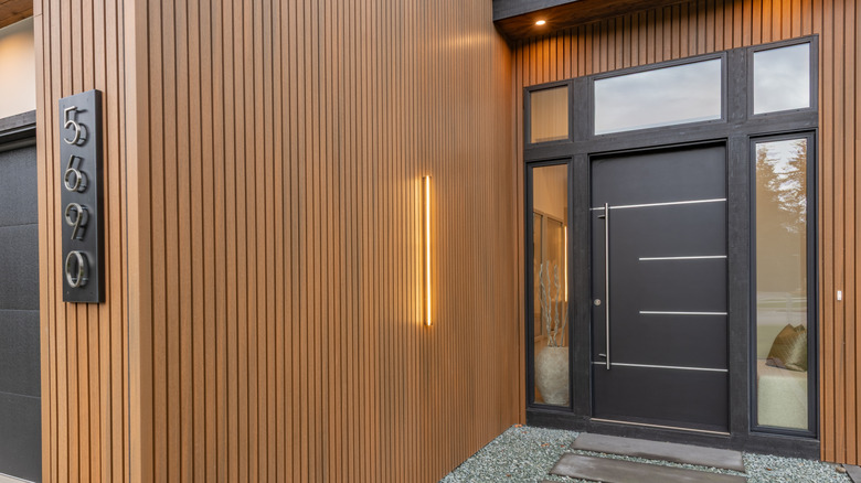 metal front door to modern home
