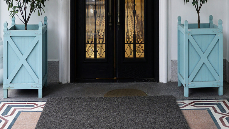 wood-clad front door made of iron