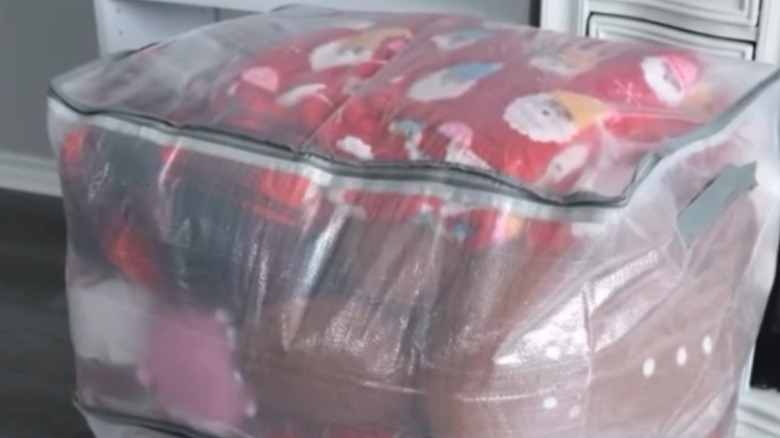Dollar Tree's clear storage bags used to store holiday pillows and blankets