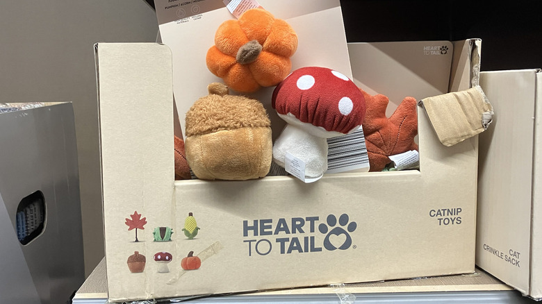 Cloth catnip toys on display in a box at Aldi.