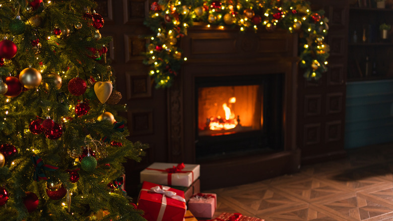 Christmas tree by a fireplace