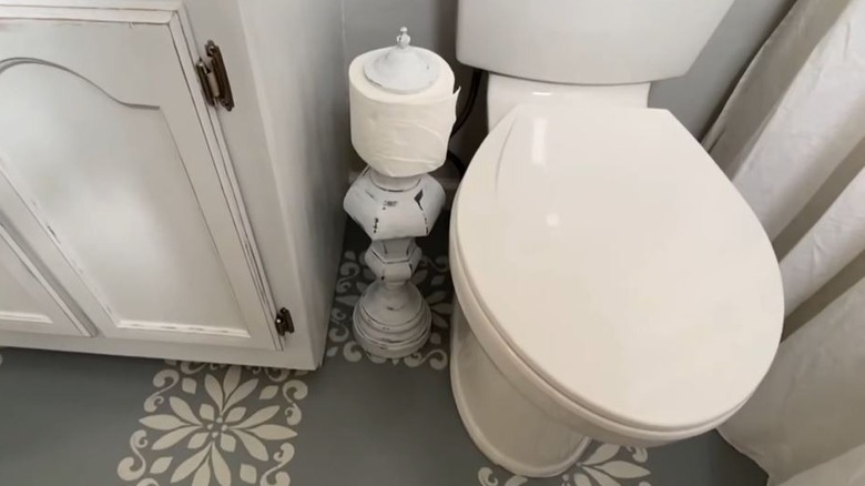 Lamp turned into a toilet paper storage piece