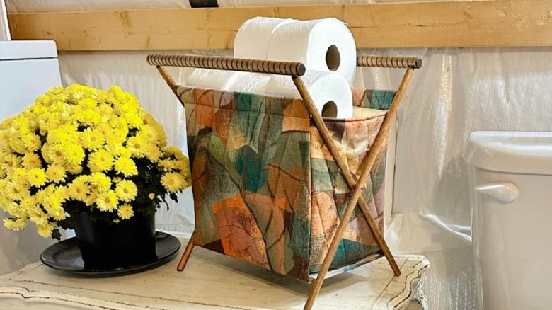 Vintage knitting basket turned into a toilet paper holder