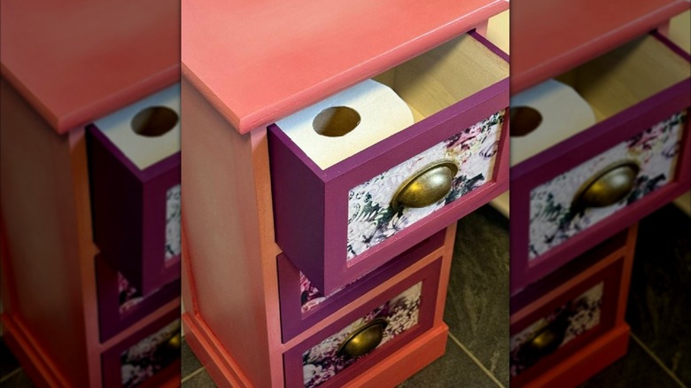 Small nightstand turned into a toilet paper storage unit