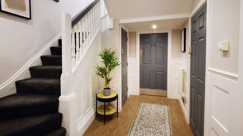 A home with a carpeted staircase