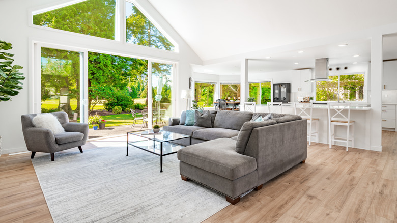 A living room with a low-pile area rug
