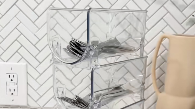 Cutlery organized in plastic bins