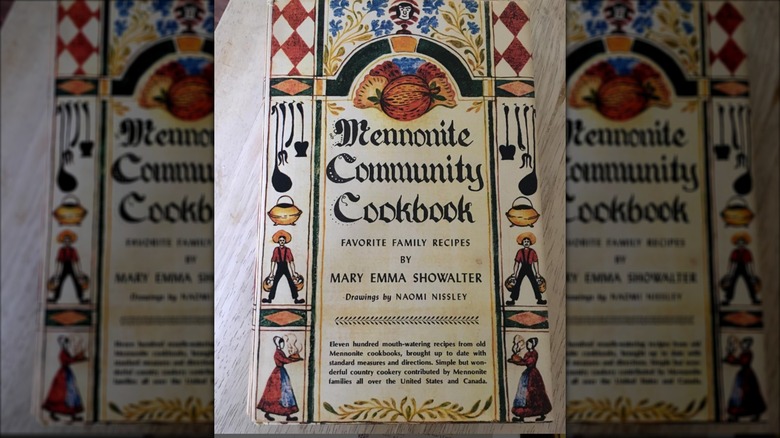 mennonite community cookbook on table