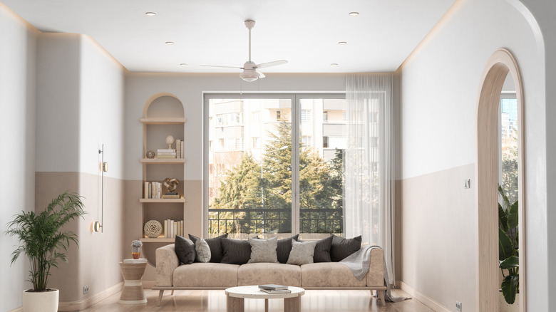 Living room with beige color capping on the walls
