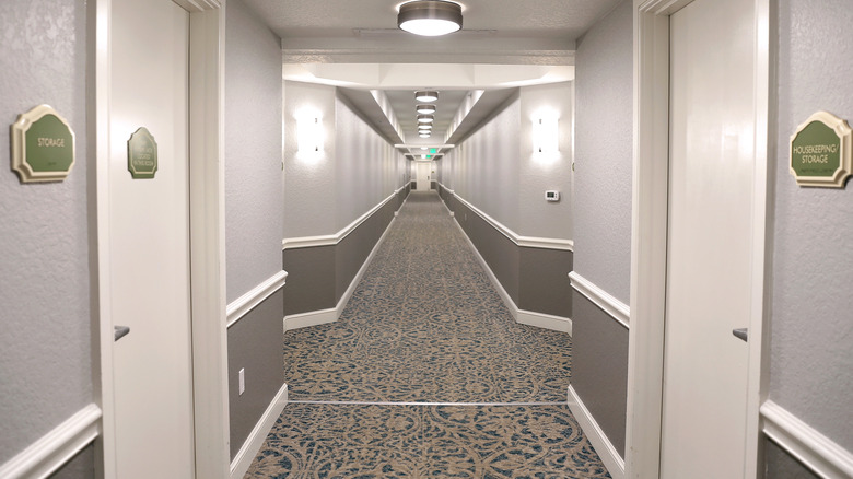 Hotel hallway with gray walls painted in different shades