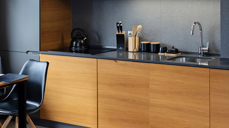 Gray kitchen backsplash and cabinets with honey oak features