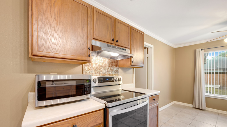 Kitchen with honey oak cabinets