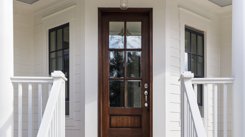 Rich brown stained door leading to porch