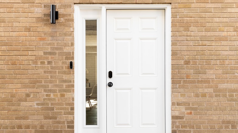Stark white front door on a brick house