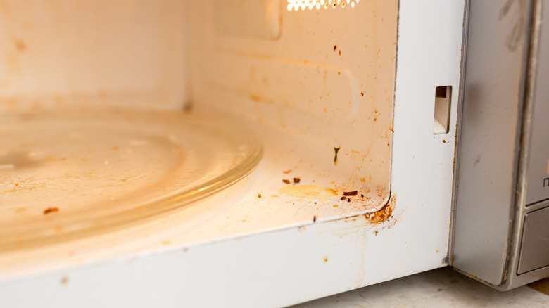 A close-up of a dirty microwave