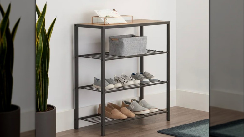 TRINITY 4-tier shoe rack with console top holding multiple pairs of shoes in entryway