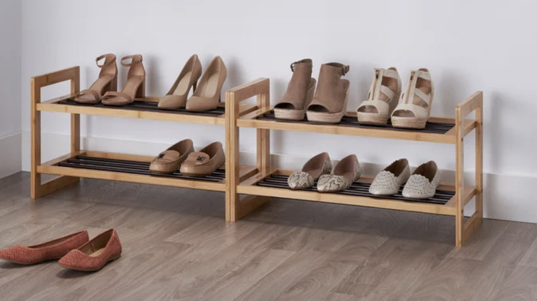 TRINITY bamboo shoe racks, side by side and filled with a variety of shoes