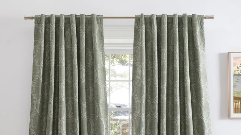 Silk Home Mitchell blackout curtains in sage cover a window