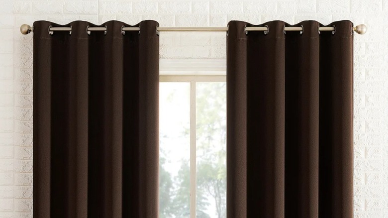 The top of Sun Zero Broderick theater grade blackout curtains over a window