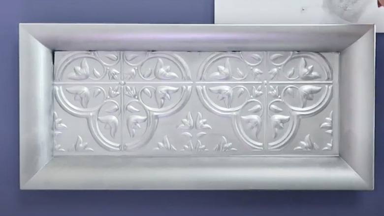 tray with silver peel and stick tiles inside