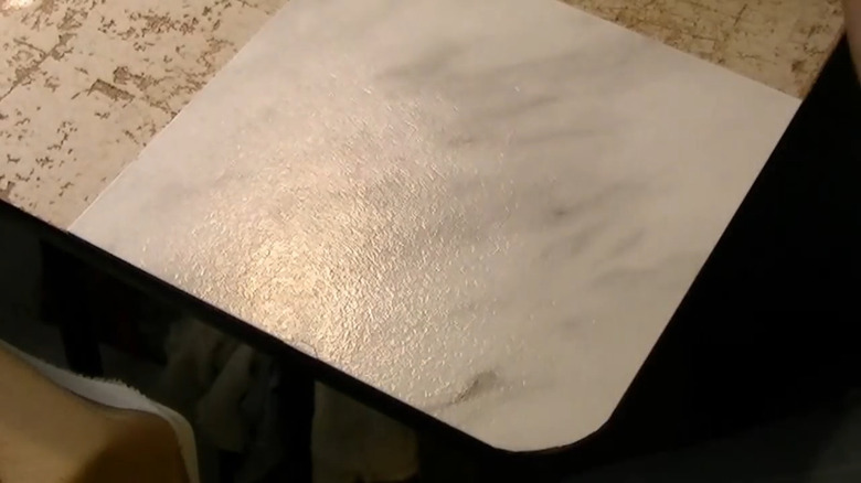 DIY table surface vinyl tile refresh project in process