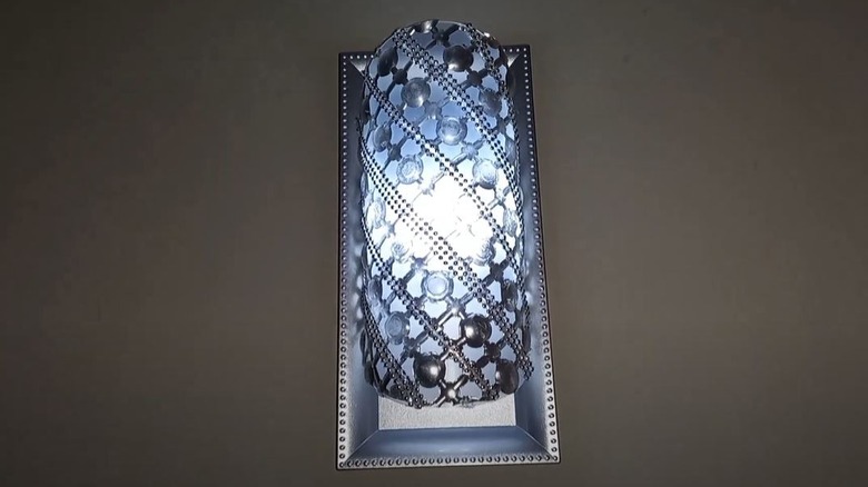 DIY wall sconce made from Dollar Tree bath mat
