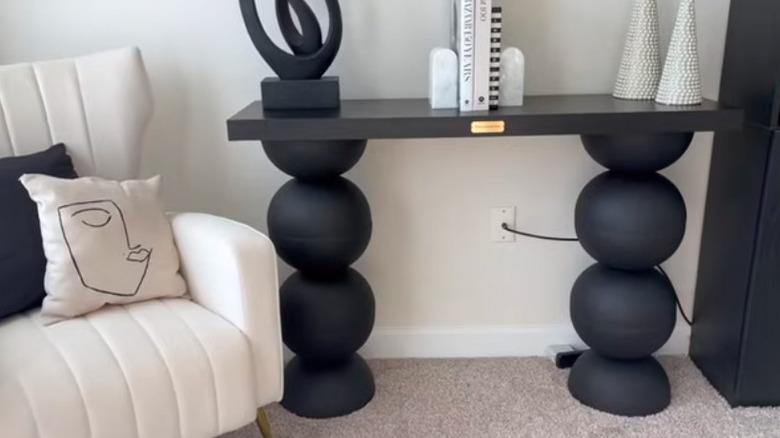 Close up of DIY black round wooden console table