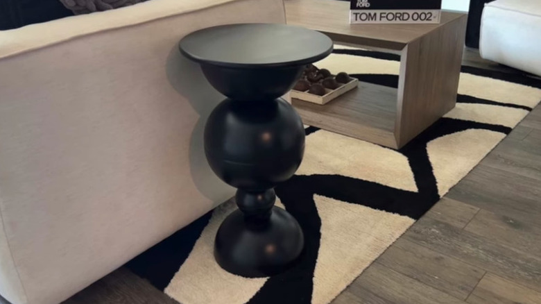 Close up of DIY black round wooden coffee table