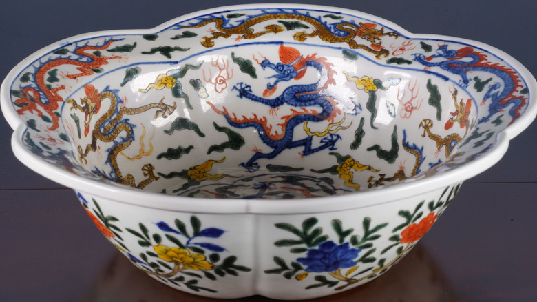 A decorative bowl with a vibrant, multi-colored design