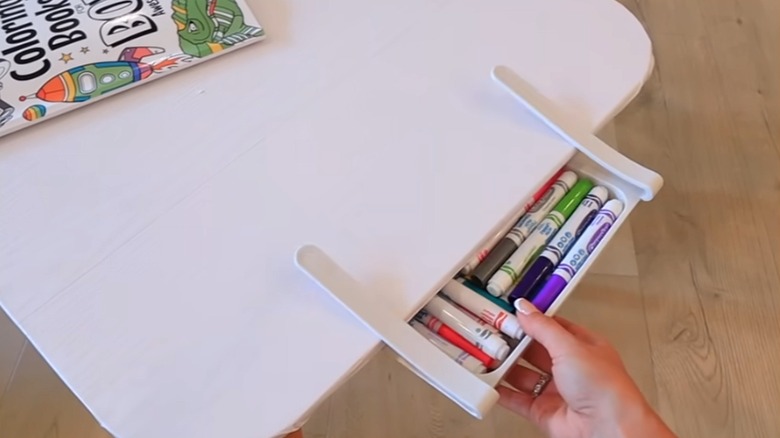 Egg drawer holding markers on play table