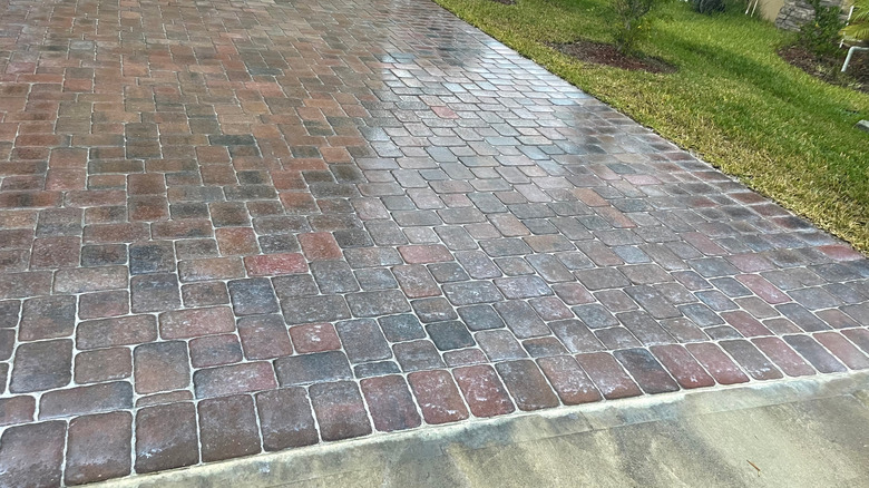 Glossy driveway with small pavers