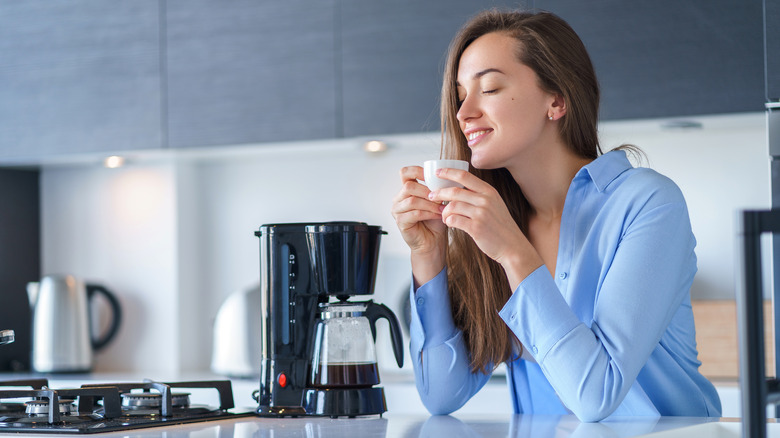 Woman sitting drinking coffee