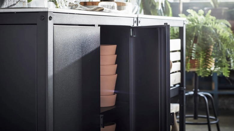 A kitchen island shelf unit with storage showing