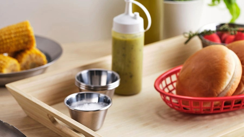 Red plastic serving baskets used to hold burger buns