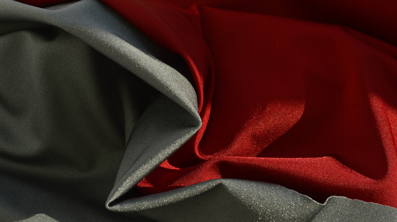 Swatches of red and gray rayon fabric