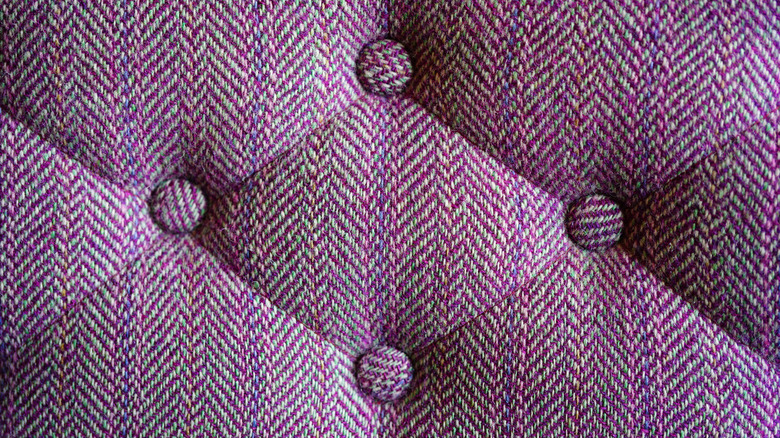 Tweed upholstered seat back.